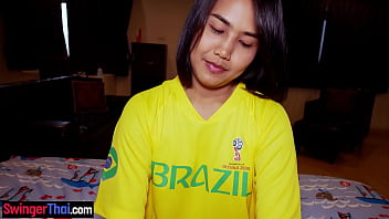 Asian teen hottie in a World Cup jersey gives head and bounces on top of a hard cock